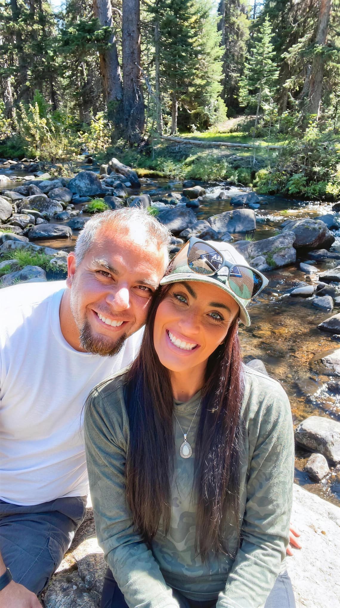 Seth Montoya and Jennifer Shepardson by a mountain creek